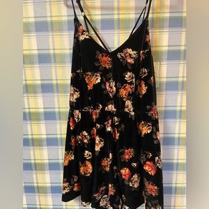 Black floral strap velvet romper.
